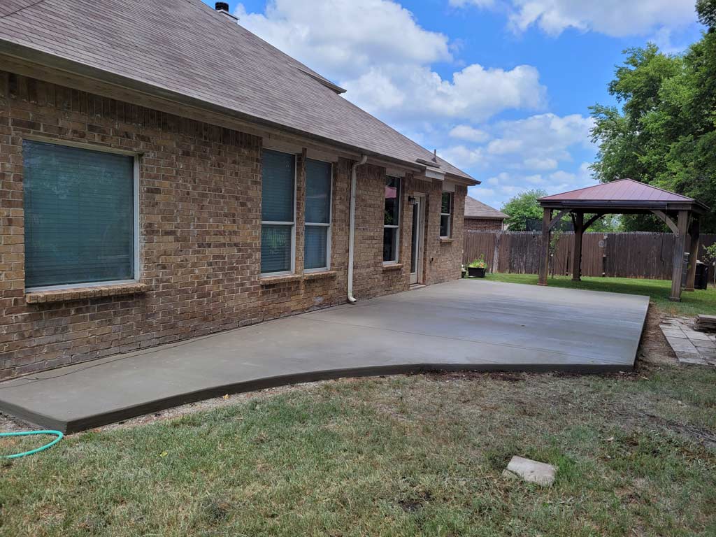 Covered patio and poured slab completed by Texas Patios Plus
