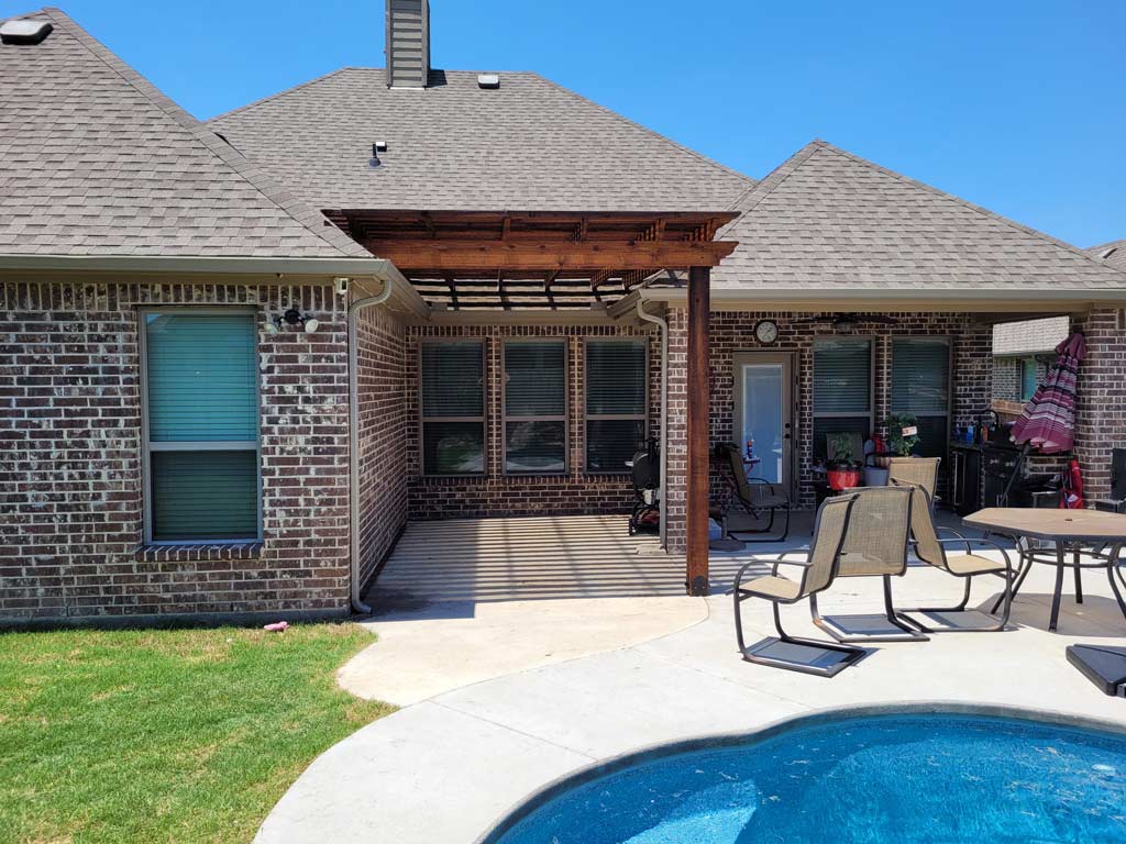 Pergola over an existing pool deck completed by Texas Patios Plus