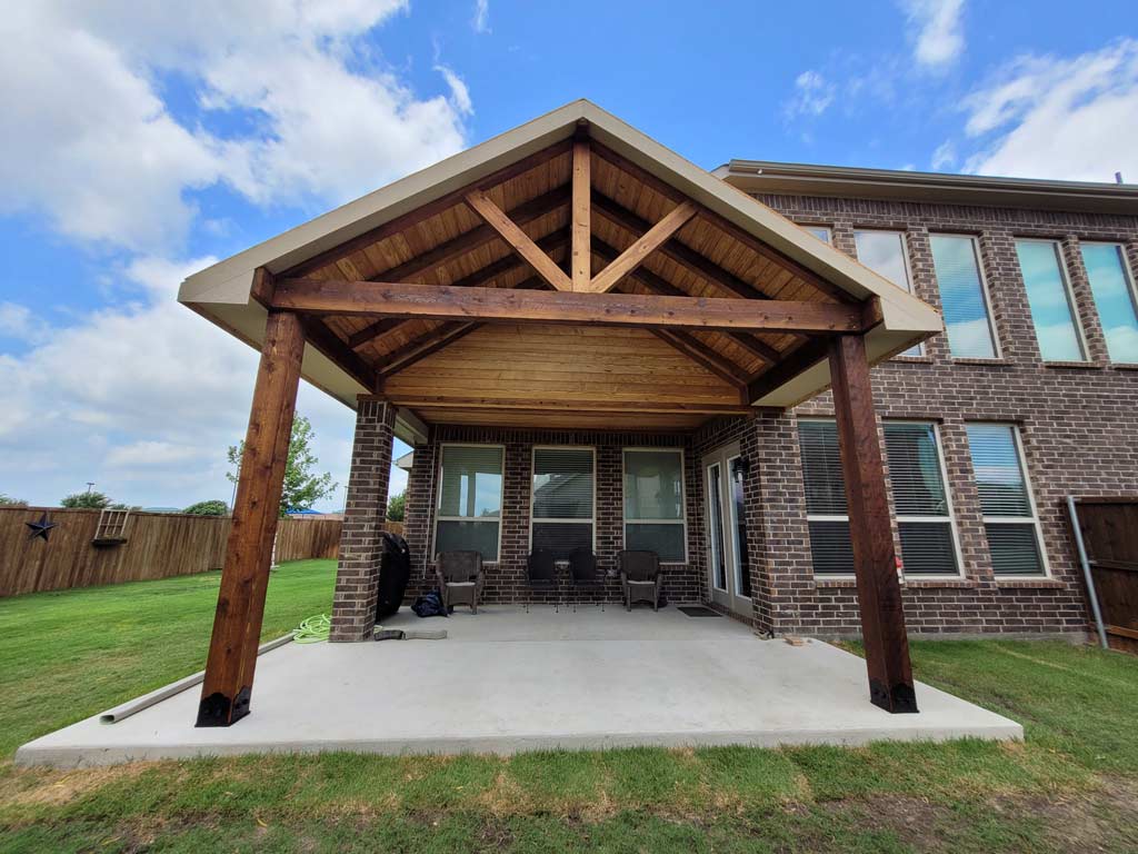 Gable-roof covered patio completed by Texas Patios Plus