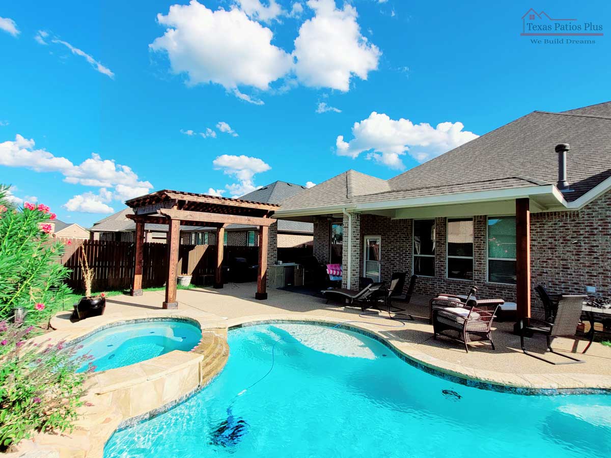 Poolside covered patio and decking completed by Texas Patios Plus