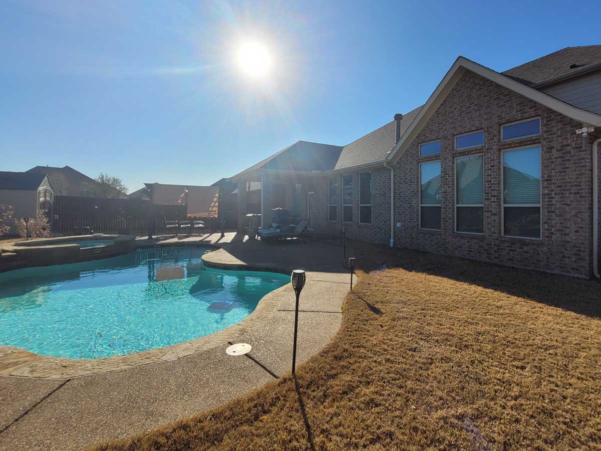 Poolside covered patio and decking before construction